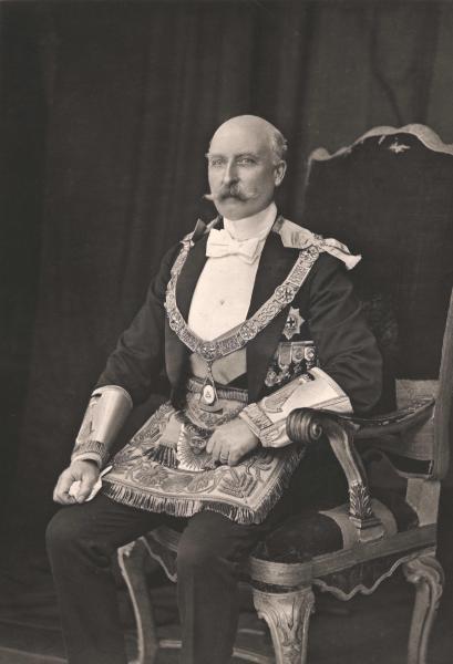Arthur, Duke of Connaught, wearing regalia as Grand Master, sat in a throne