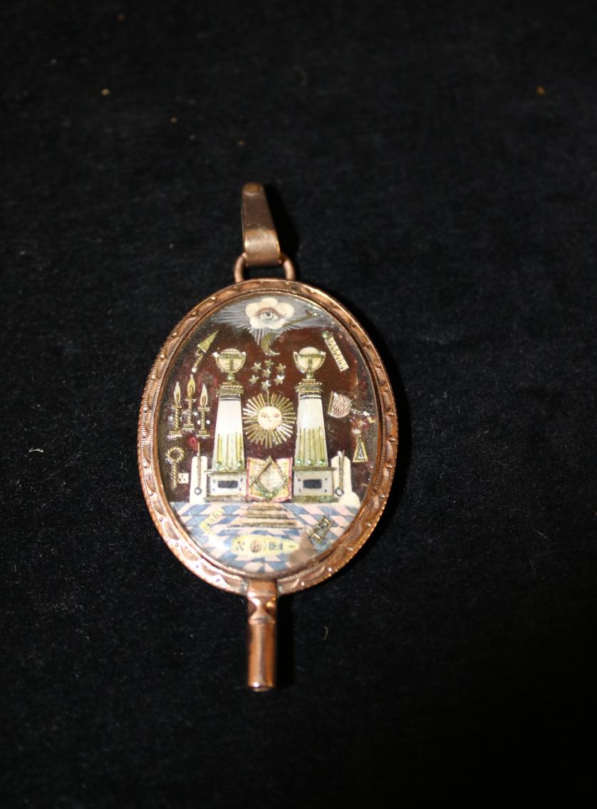 Masonic jewel converted into a key for a watch